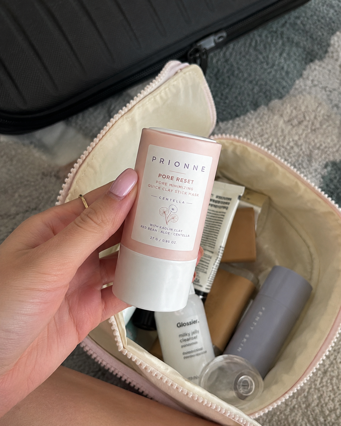 Female customer packing Prionne clay stick in a cosmetic bag
