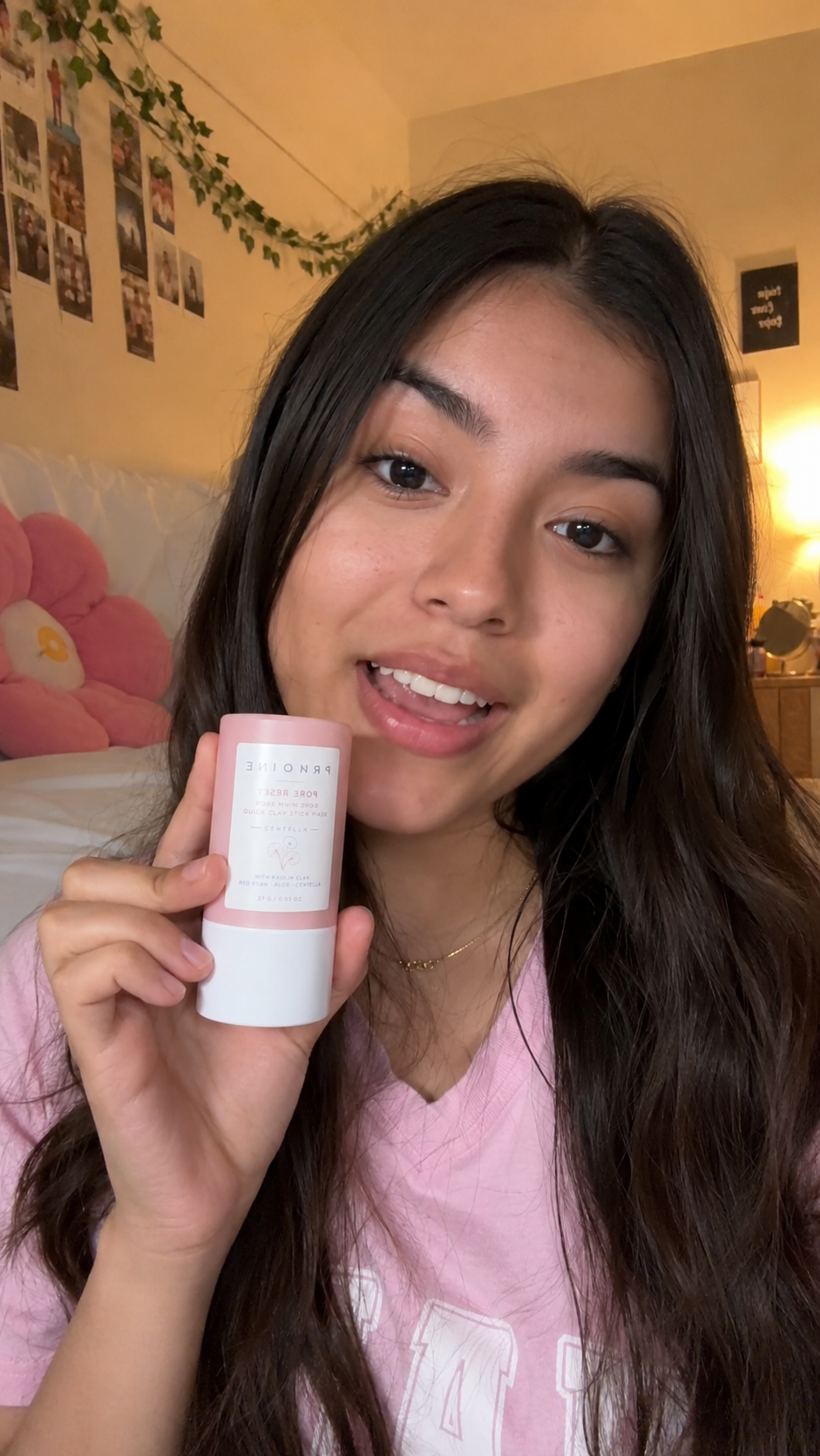 Young female customer in dorm room holding Prionne clay mask stick